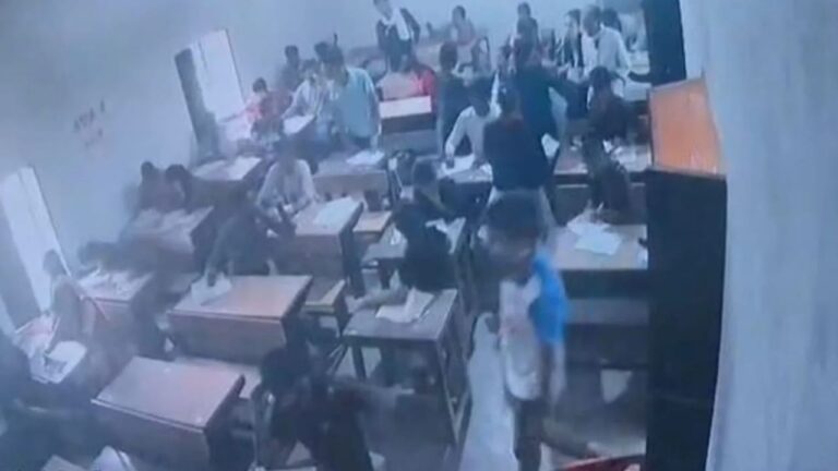 CCTV footage showed students cheating by keeping the guide with the teacher.